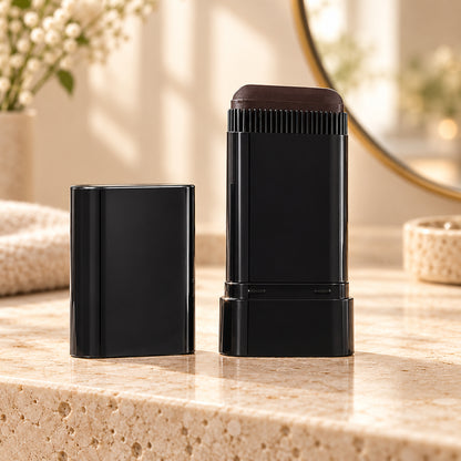 Black hair root touch-up colour stick on a vanity